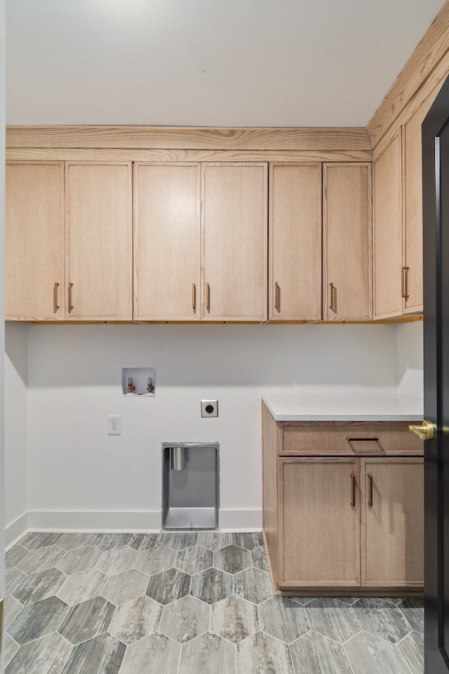 laundry area featuring electric dryer hookup, cabinets, and washer hookup