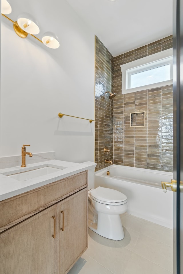 full bathroom with toilet, vanity, tile patterned floors, and tiled shower / bath