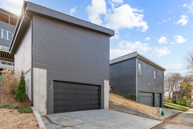 view of property exterior with a garage