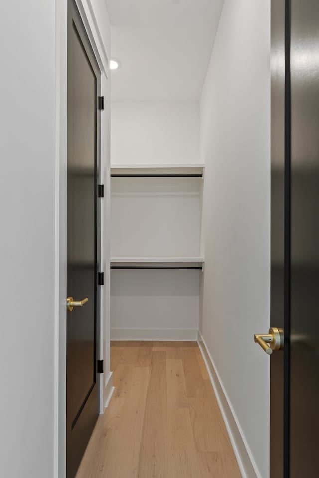 walk in closet featuring light wood-type flooring