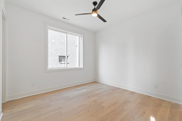 spare room featuring ceiling fan and light hardwood / wood-style floors