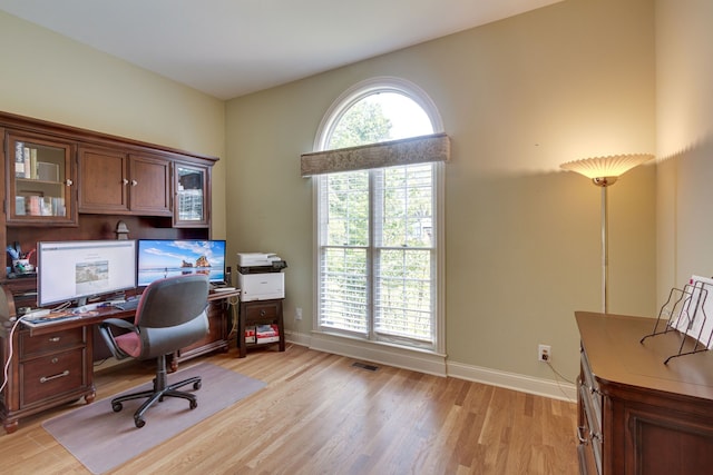 home office with light wood-type flooring