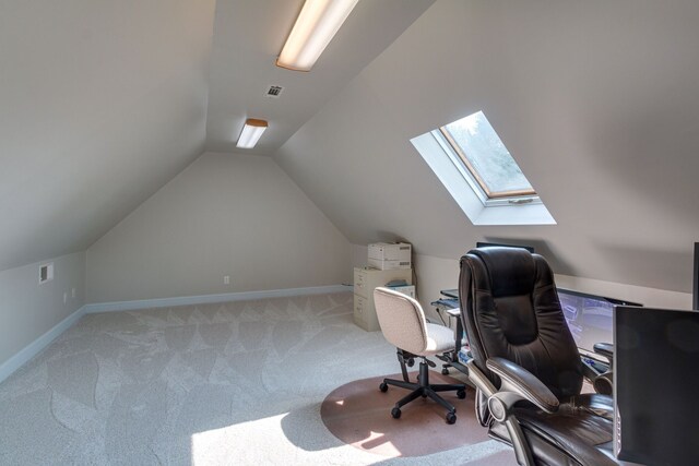 office with carpet and vaulted ceiling