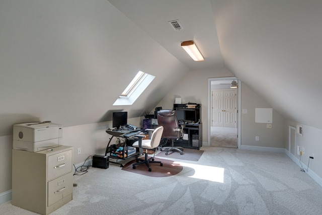 carpeted office space with vaulted ceiling