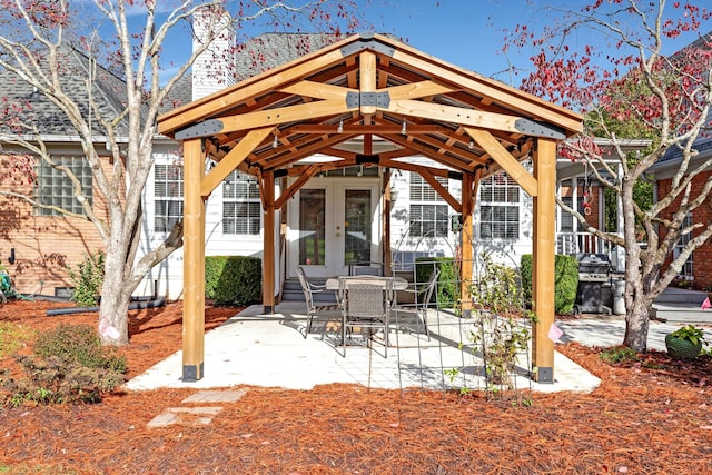 view of patio / terrace featuring french doors, grilling area, and a gazebo