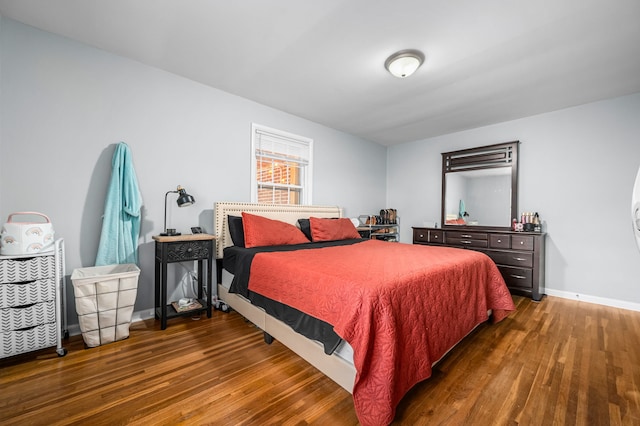 bedroom featuring dark hardwood / wood-style flooring