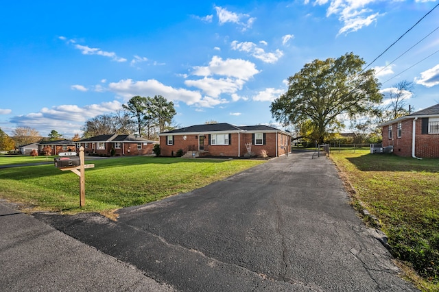 ranch-style home with a front yard