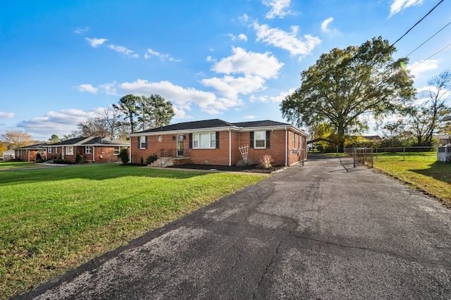 ranch-style home with a front yard