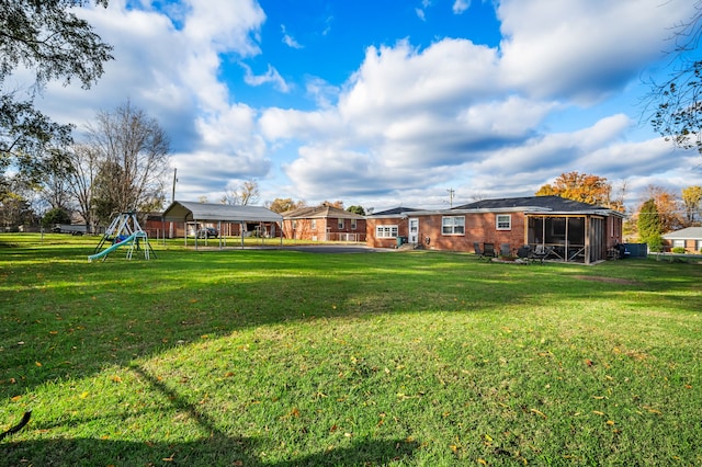 view of yard featuring a sunroom