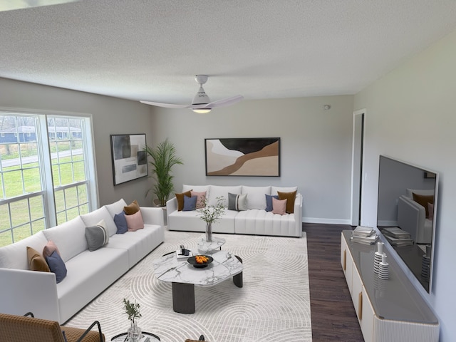 living room with ceiling fan, dark hardwood / wood-style flooring, and a textured ceiling