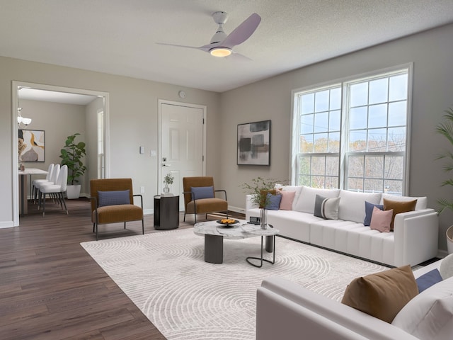 living room with dark hardwood / wood-style floors, ceiling fan, and a textured ceiling