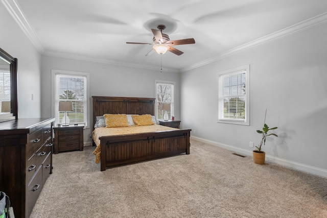 carpeted bedroom featuring ceiling fan, ornamental molding, and multiple windows