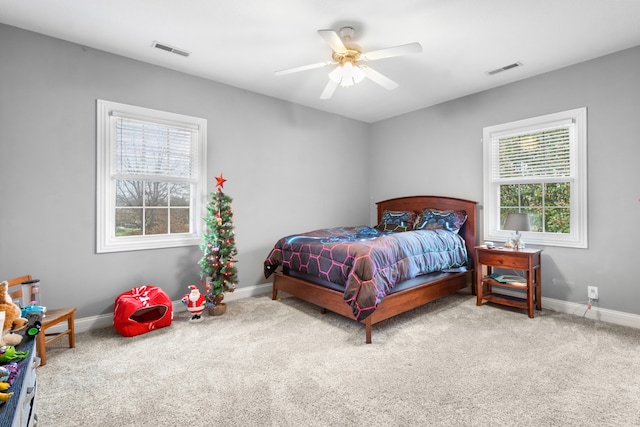 carpeted bedroom featuring ceiling fan