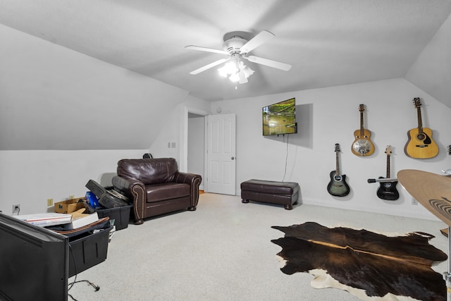 interior space with carpet, vaulted ceiling, and ceiling fan