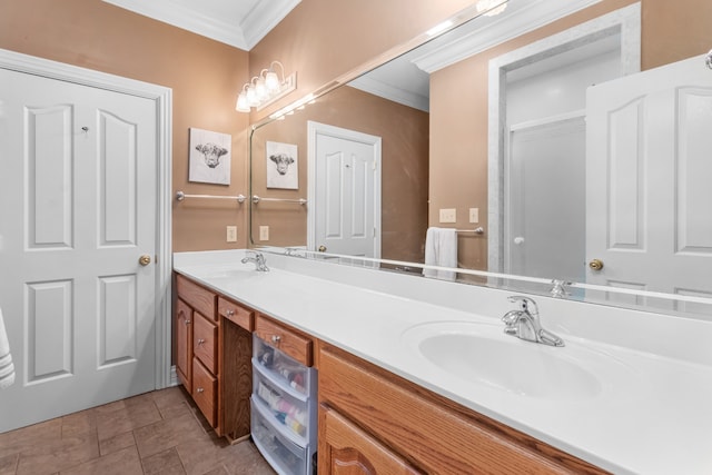 bathroom featuring tile patterned flooring, vanity, and crown molding