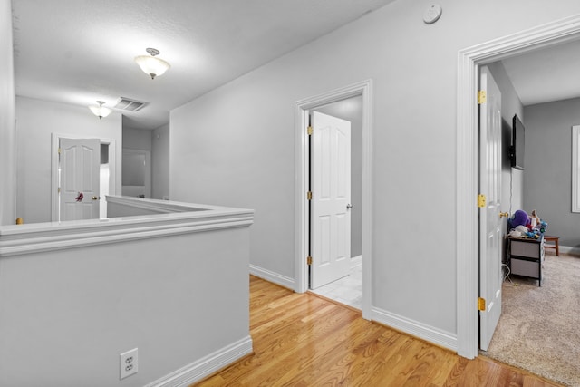 hallway featuring light hardwood / wood-style floors