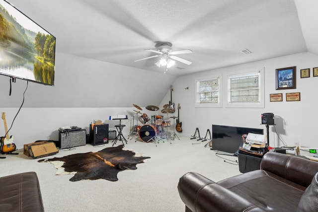 interior space with a textured ceiling, ceiling fan, and vaulted ceiling