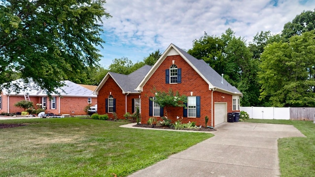 view of front facade with a front yard and a garage