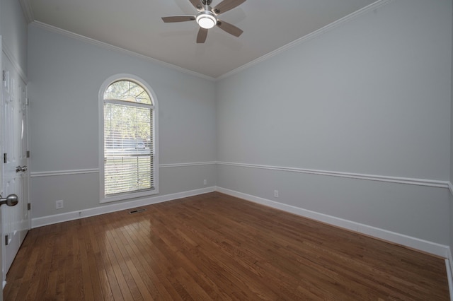 spare room featuring dark hardwood / wood-style floors, ceiling fan, and ornamental molding