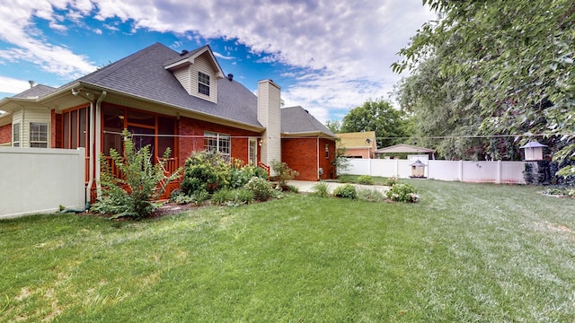 view of yard with a sunroom