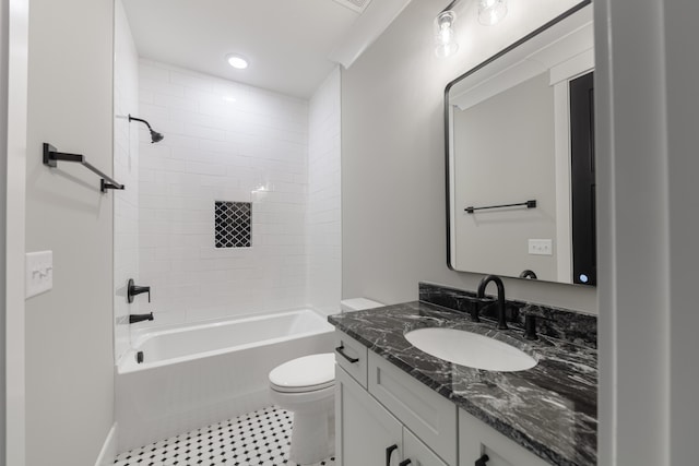 full bathroom featuring vanity, toilet, and tiled shower / bath combo