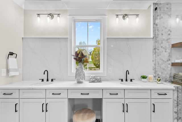 bathroom featuring vanity and a healthy amount of sunlight