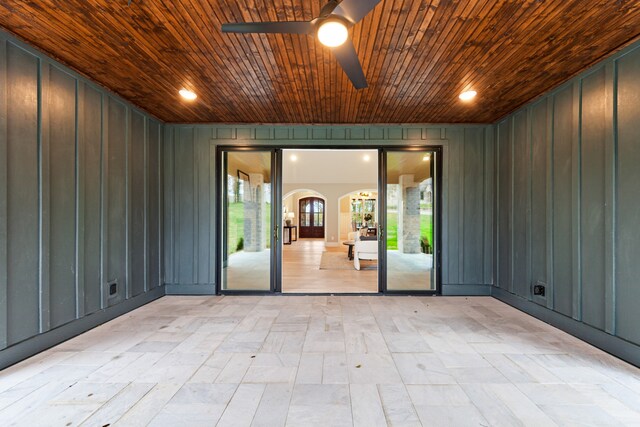 unfurnished room featuring ceiling fan and wood ceiling