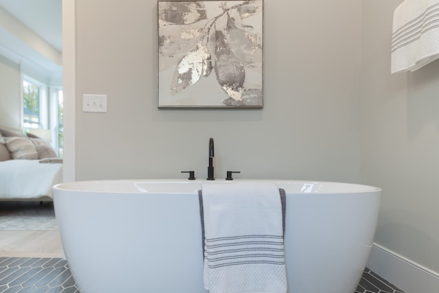 bathroom with a tub to relax in