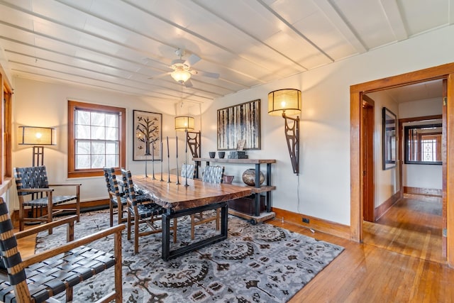 dining area with ceiling fan and hardwood / wood-style flooring