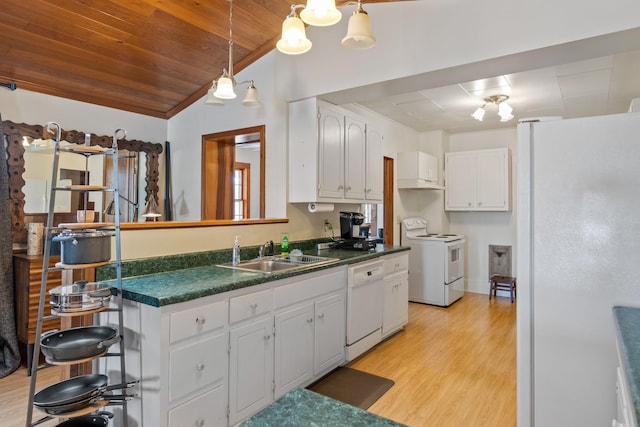 kitchen featuring white appliances, sink, decorative light fixtures, white cabinets, and light hardwood / wood-style floors