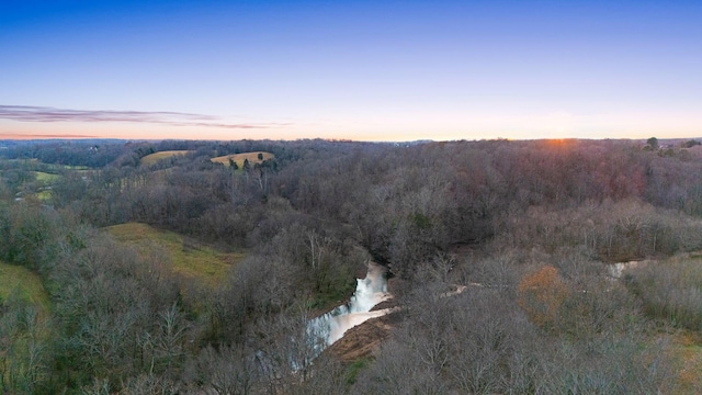 aerial view at dusk with a water view