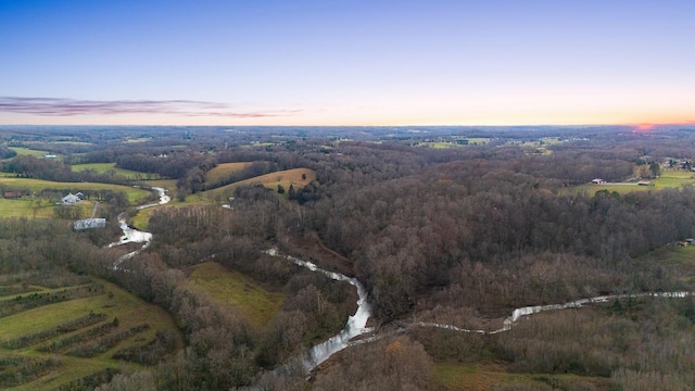 aerial view at dusk featuring a rural view