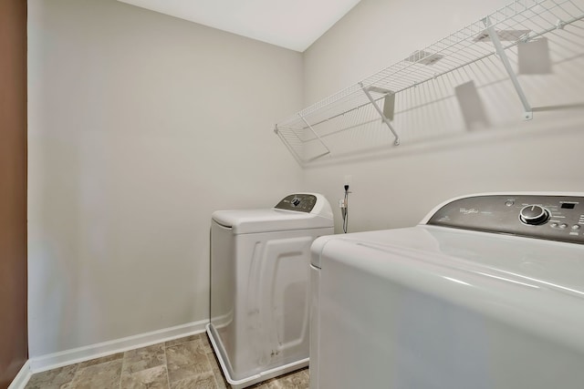 clothes washing area featuring washing machine and dryer