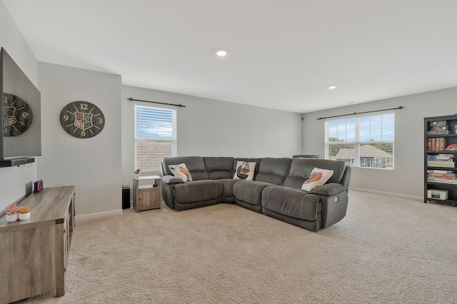 living room with light carpet and a wealth of natural light