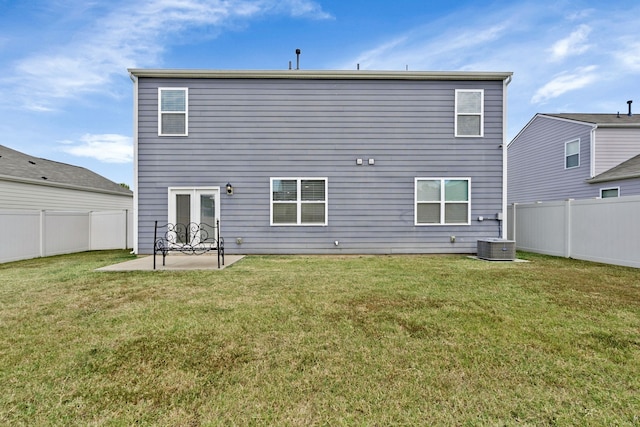 back of house featuring a patio area and a yard