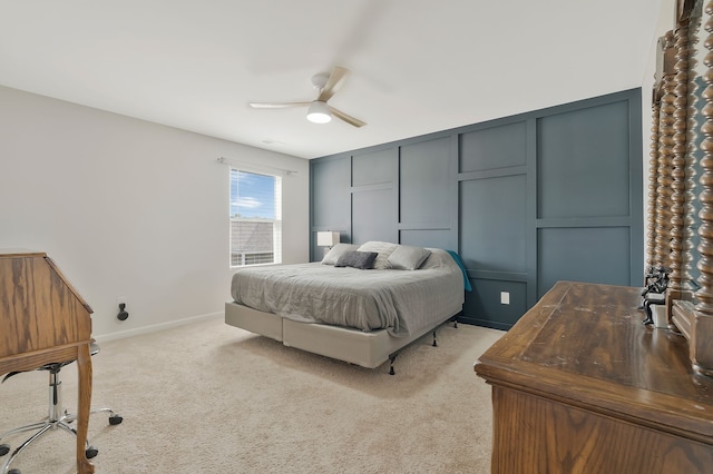 bedroom featuring light colored carpet and ceiling fan