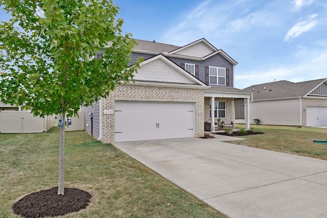 view of front of property featuring a front yard and a garage