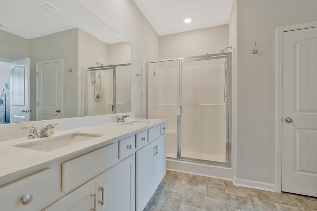 bathroom featuring vanity and walk in shower