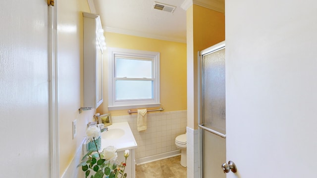 bathroom with tile patterned flooring, vanity, toilet, and crown molding