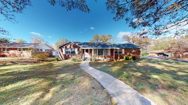 view of front of house with covered porch and a front yard