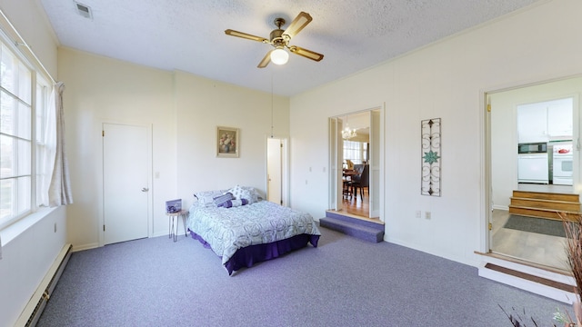 carpeted bedroom with connected bathroom, ceiling fan, a textured ceiling, and a baseboard heating unit