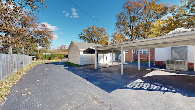 exterior space with a carport