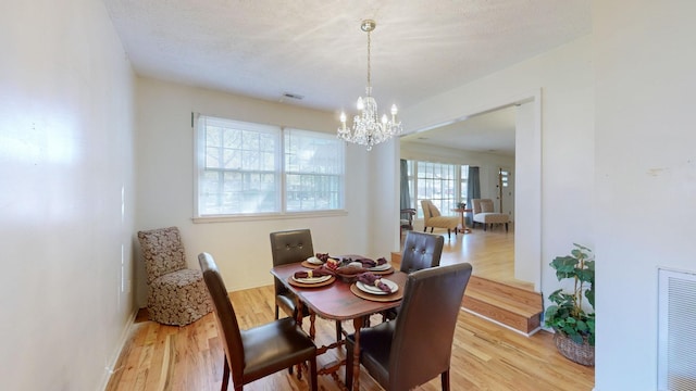 400 Edgewood Dr, Tullahoma, TN 37388 - dining area with a chandelier and light wood finished floors