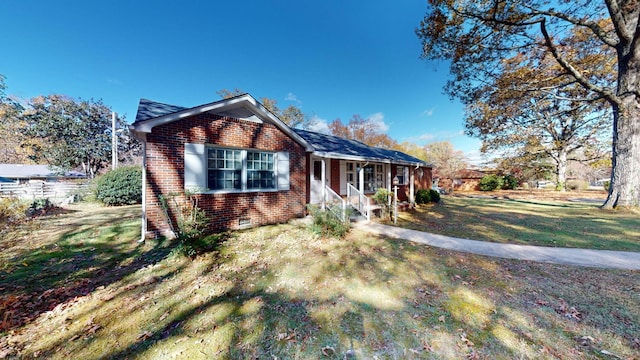 400 Edgewood Dr, Tullahoma, TN 37388 - view of front of home featuring a porch, brick siding, a front yard, and crawl space