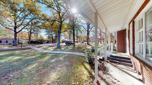 view of yard with covered porch