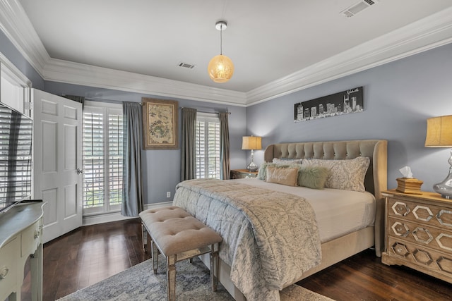 bedroom featuring ornamental molding and dark wood-type flooring