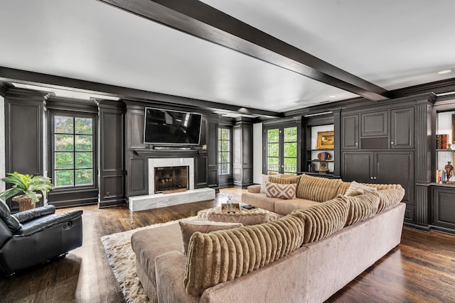 living room featuring a fireplace, dark hardwood / wood-style floors, and beamed ceiling