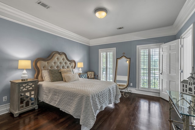 bedroom featuring ornamental molding and dark hardwood / wood-style floors