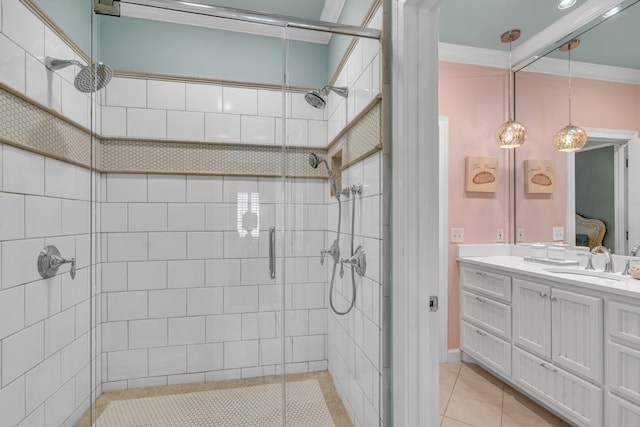 bathroom featuring tile patterned flooring, vanity, crown molding, and a shower with shower door