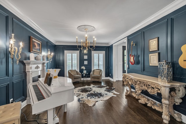 living area featuring an inviting chandelier, crown molding, and dark wood-type flooring